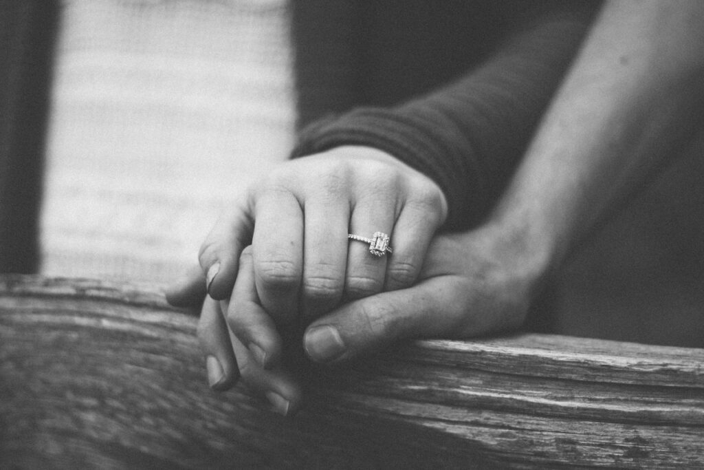 Photo by <a href="https://unsplash.com/@shelbymary_?utm_source=unsplash&utm_medium=referral&utm_content=creditCopyText">Shelby Deeter</a> on <a href="https://unsplash.com/photos/a-couple-holding-hands-with-a-wedding-ring-visible--XlBjdtRqK8?utm_source=unsplash&utm_medium=referral&utm_content=creditCopyText">Unsplash</a>